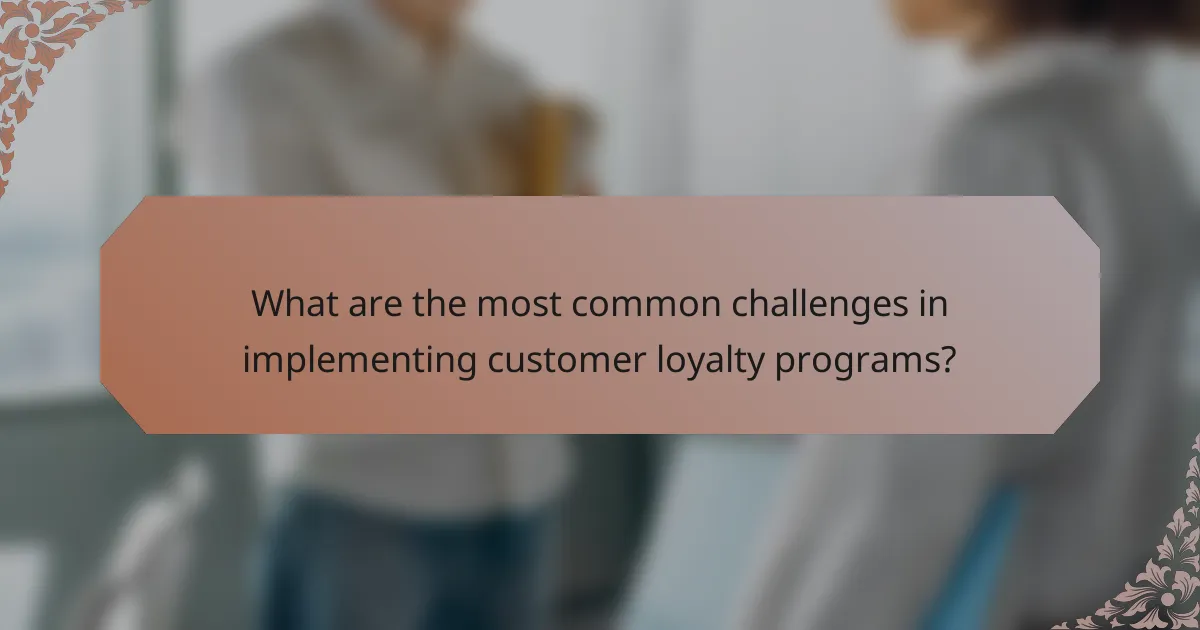 What are the most common challenges in implementing customer loyalty programs?